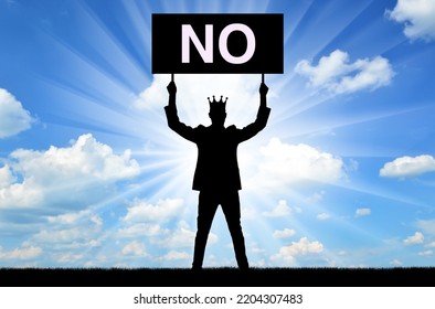 Selfishness. Selfish Male Businessman Or Boss With A Crown, Holding A Poster With The Word No. The Concept Of Complete Egoism And Ignoring Compromises. Silhouette