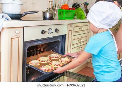 Self-isolation,  Stay Home, Little Kid Boy Helps Mother To Cook Pizza. Happy Family Mom And Child In Weekend Morning At Home. Relationship. 