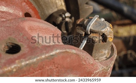 a self-locking nut securely fastens a car spare part, close-up