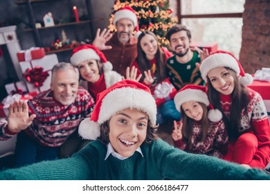 Self-portrait of attractive cheerful family waving hello greetings having fun eve advent party time at home indoors - Powered by Shutterstock