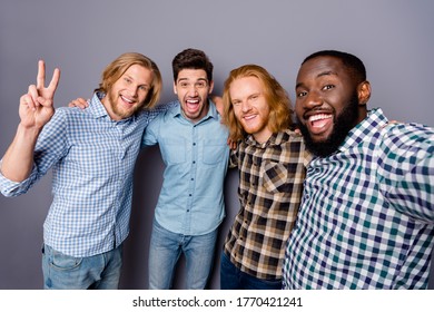 Self-portrait of four nice attractive glad cheerful cheery positive guys embracing having fun gathering showing v-sign isolated over gray purple pastel color background