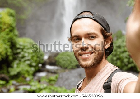 Similar – Foto Bild maennliches portrait im wald