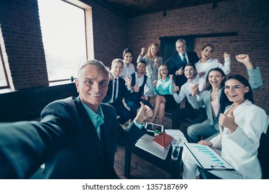 Self-portrait of nice stylish cheerful excited glad executive company staff showing thumbsup yes goal corporate culture agree advice at modern industrial loft interior work place space
