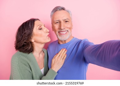 Self-portrait Of Two Handsome Beautiful Tender Sweet People Kissing Isolated Over Pink Pastel Color Background