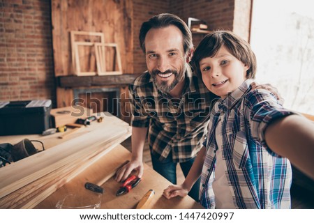Self-portrait of two nice person cheerful cheery woodworkers handymen generation creating construction at school course class studio modern loft industrial brick interior indoors