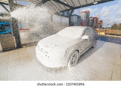 self-service car wash with huge amount of foam
