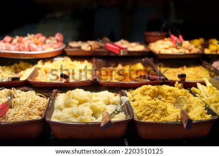 
self-service restaurant with meals distributed separately inside porcelain platters
