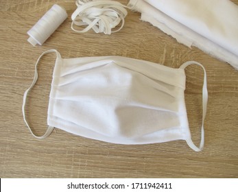 Self-sewn fabric face mask made of white cotton