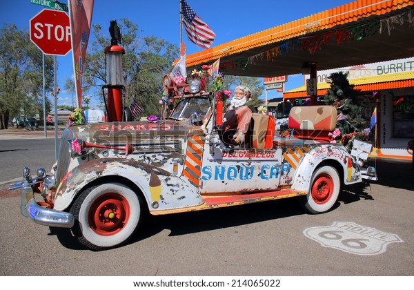 SELIGMAN, ARIZONA - AUGUST 16, 2014: Eccentric car\
parked on Mother Road, on August 16, 2014 in Seligman, AZ. Seligman\
is famous as origin of Route 66 and inspiration for the town of the\
movie Cars.