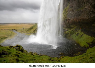 Seljalandsfoss, Iceland - Aug 22 2022: A Step Away From The Ring Road, Seljalandsfoss Is Born, A Waterfall Over 60 Meters High Located In An Unparalleled Landscape.