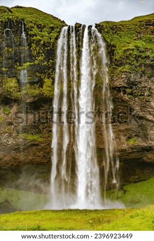 Seljalandsfoss, Iceland, one of the biggest waterfall in Iceland Seljalandsfoss. Beautiful Icelandic landscape, huge cliff, and dramatic sky