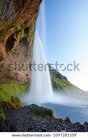 Waterfall in Iceland in cloudy weather