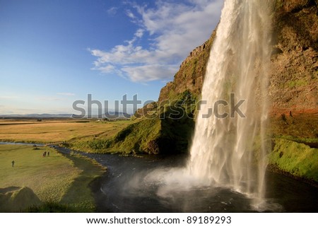 Seljalandsfoss waterfall at dusk, near Eyjafjallajokull glacier in South Iceland. Stock photo © 