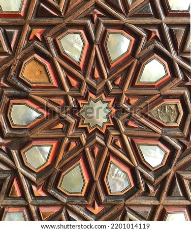 The Seljuk motif is the 10-pointed star, which is also a historical motif applied on the doors. The motif was applied on the door and made with mother-of-pearl decorations.
