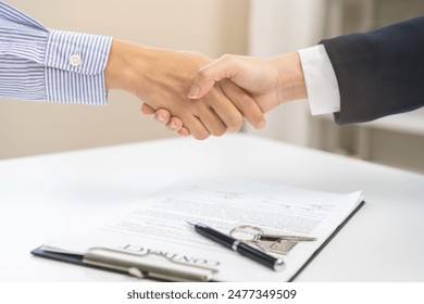 Sell agent, success deal asian young woman handshake or shaking hands with landlord realtor, client male after buyer man signed rental, lease contract. Banker agreement mortgage loan, property lease.