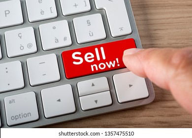Sell now button with finger on a computer keyboard - Shutterstock ID 1357475510