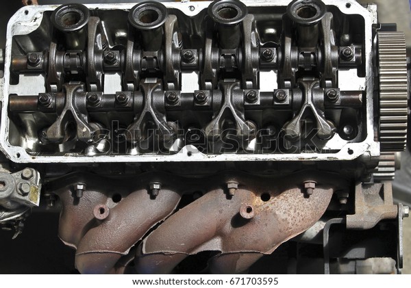Sellective focus. The\
top of the cylinder head with two engine engine camshafts with\
fully timing belt