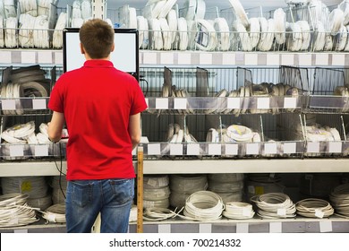 Seller At The Computer For Inventory Of Products In Hardware Store.