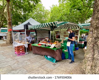 Seller In Farmers Market Wearing A Mask Belgravia London UK July 2020