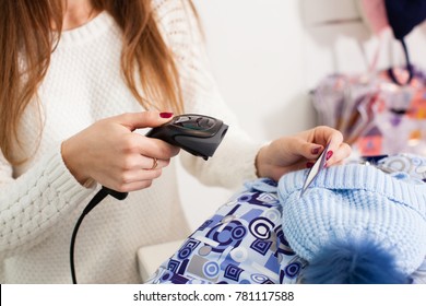 Seller Holding Barcode Scanner In A Hand