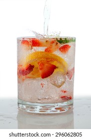 Seltzer Drink With Fresh Cut Fruit Floating Inside