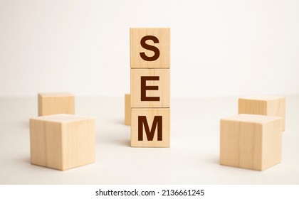 SEM symbol. Concept word 'SEM - search engine marketing' on wooden cubes and blocks on a beautiful white background. Business and search engine marketing - SEM concept. Copy space.