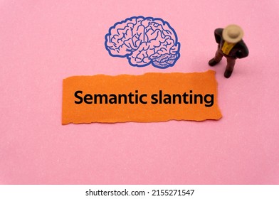 Semantic slanting.The word is written on a slip of colored paper. Psychological terms, psychologic words, Spiritual terminology. psychiatric research. Mental Health Buzzwords.