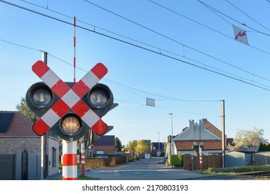 Semaphore on railway crossing. Warning road sign about the proximity of a railway crossing.