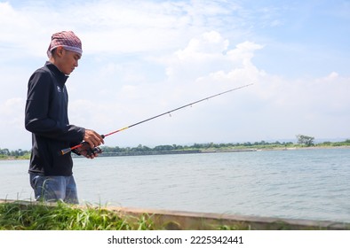 Semarang, 11 November 2022 People Fishing On The Marina Beach