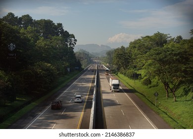 Semarang, April 04 2022 : Cars Cross The Semarang Solo Toll Road In The Morning With A Beautiful Background