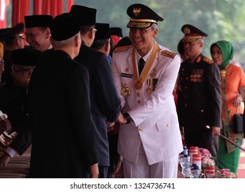 Semarang, Central Java / Indonesia - August 17 2017: Central Java Governor Ganjar Pranowo Is Shaking Hands