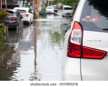 SEMARANG, INDONESIA - 12 FEBRUARY 2021: cars are being moved during deep flood conditions. - Shutterstock ID 1937890378
