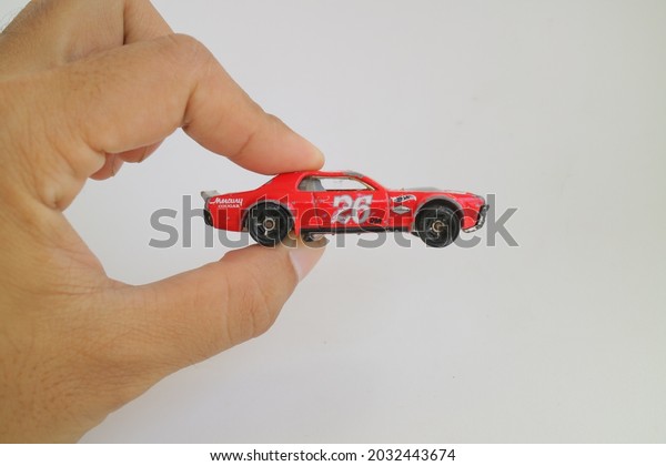 SEMARANG, INDONESIA 25 august 2021:\
Collection of toy cars, Hot Wheels in red color. Hot Wheels is a\
scale die-cast toy cars by American toy maker\
Mattel