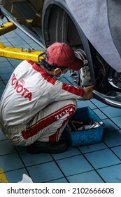 Semarang, Indonesia - December 14, 2021: Mechanic repairing car at car showroom dealer Toyota