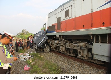 Semarang, Indonesia - July 10th 2014 : A Car Was Hit By A Train For Violating The Crossing