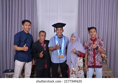 Semarang, Indonesia - September 24 2019: Happy Asian Family Graduation. Graduation Photo With Family.