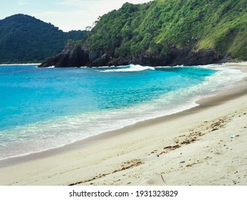 Semeti beach with its beauty in the form of white sand, blue sea and kryptonite rocks, a hidden beach in Lombok, Indonesia