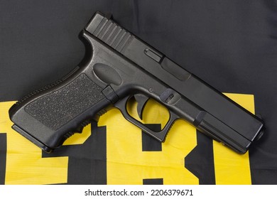 Semi Auto Handgun On Fbi Raid Jacket Black Uniform Background