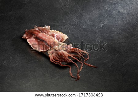Semi dried squid photographed on gray background Stock photo © 