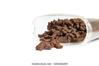 Semi Moist Dog Food Falling Out Of Storage Container. Random Placed Isolated Soft And Chewy Dog Food Pieces. Brown Soft Kibble With Lamb As Mono Protein. Selective Focus. White Background.