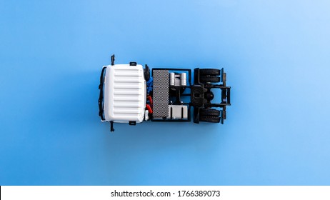 Semi trailer truck lorry cargo vehicle on blue background, View from above, Aerial top view of white semi truck.