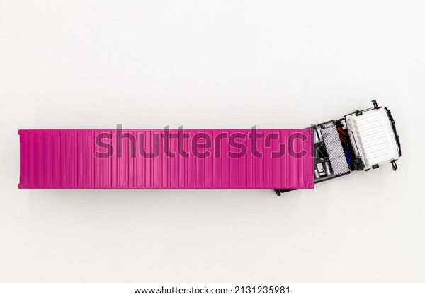 Semi\
trailer truck lorry container cargo vehicle on white background,\
View from above, Aerial top view of semi truck with container\
cargo, Business logistic and transportation\
compay.