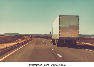 Semi Trailer Truck on an American West Route. Interstate I-70 Utah, United States of America. Rear View. 