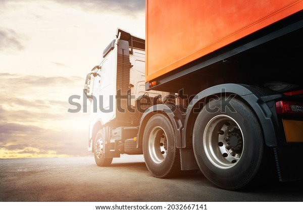 Semi Trailer Truck\
a Parking at Sunset Sky. Industry Road Freight Truck. Logistic and\
Cargo Transport Concept.