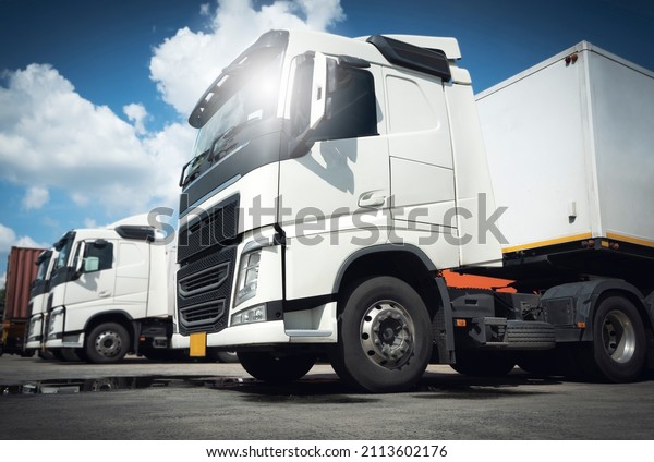 Semi Trailer Truck Parking lot  at The
Warehouse. Shipping Cargo Trucks. Lorry. Industry Freight Truck
Logistics Cargo
Transport.
