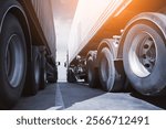 Semi Trailer Trucks on The Parking Lot. Economy Business Transport on Road. Truck Wheels Tires. Cargo Container Shipping. Import- Export. Truck Freight Logistics Transportation.