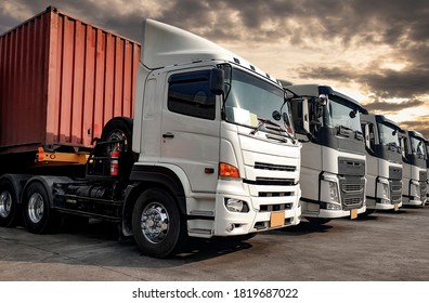 Semi Trailer Trucks the Parking lot at The Sunset Sky. Delivery Trucks. Cargo Shipping. Lorry. Industry Freight Truck Logistics Cargo Transport Concept.	