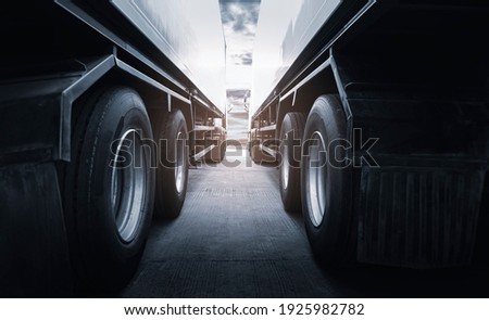 Semi Trailer Trucks the Parking at Sunset Sky. Truck Wheels Tires. Industry Cargo Freight Truck Transportation.