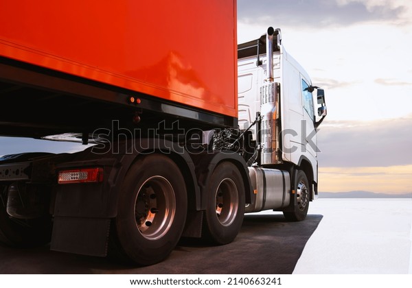 Semi\
Trailer Trucks The Parking with Sunset Sky. Shipping Trucks. Lorry.\
Industry Freight Trucks Logistics Cargo\
Transport.	