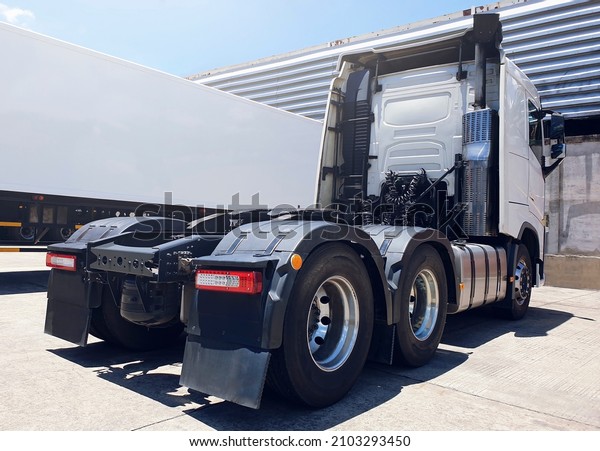 Semi\
Trailer Trucks Parking at The Warehouse. Tractor Truck. Lorry.\
Industry Cargo Freight Truck Logistic Transport\
